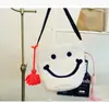Bolsa de palha trançada de planta pp para mulheres coreanas, bolsa de barril tecida à mão com rosto sorridente