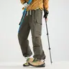 Nuevos pantalones de exterior estilo montaña, pantalones de trabajo a prueba de viento e impermeables para hombres y mujeres, pantalones de senderismo de corte holgado, adecuados para ir al trabajo y uso casual