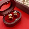 Pendientes Pequeños de Calabaza Roja de Año Nuevo, Pendientes del Año del Zodiaco Caballo, 2026 Otoño e Invierno Caliente Venta de Clips para Orejas de Año Nuevo al por Mayor
