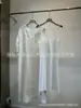 Vestido Midi de Linho com Gola V de Manga Três Quartos, Bordado Pesado e Detalhe de Renda, com Alças - Lançamento Primavera/Verão 2025