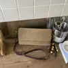 2025 Novo Design de Nicho Tendência Bolsa de Ombro Único de Alta Qualidade para Mulheres Outono e Inverno Versátil Baguete de Mão Transversal