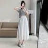 Toma Real de Ropa Femenina de Comercio Exterior: Falda Midi Versátil de Estilo Francés de Cintura Alta para Mujer, Dulce Diseño de Línea A, Blanca, para Primavera