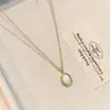 Cadena de suéter de piedra ojo de tigre retro para otoño e invierno, un collar largo nuevo y elegante con un toque de alta gama y lujo, perfecto para llevar en capas