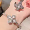 Pulsera y Anillo de Trébol de Cuatro Hojas con Perlas y Conjunto, Joyería Fresca y Dulce con Flor de Zirconia Incrustada en Concha
