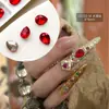Explosiones del mismo estilo joyería para uñas estilo antiguo material de armadura Huan Huan mezclado esmeralda de palacio diamante plano puntiagudo