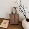 Bolsa para Garrafa de Água com Bloqueio de Cor Simples Bolsa de Mão Feminina 2026 Outono Nova Bolsa de Lona Nicho Ombro Único Bolsa Tote para o Dia a Dia