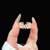 Nuevo anillo de moda de alta gama versátil estilo vintage con forma de estrella y diamantes, lujo ligero, anillo personalizado único y lujoso