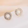 Pendientes de aro pequeño de metal transfronterizos diseño espiral cóncavo-convexo personalizado joyería de aguja de plata 925 pendientes de nicho para mujer