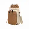 Bolsas de lona al por mayor para mujer, nuevo diseño de moda nicho verano 2026, bolso de hombro cruzado, estilo coreano popular, bolso para teléfono móvil