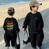 Camiseta de Manga Longa Infantil 2026 Novo Estilo Bebê Primavera Algodão Puro Camada Base Roupa Externa Desenho Animado Esportes para Meninos T