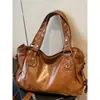 Bolsos de nicho coreanos para mujer 2026 nuevo modelo bolsa cruzada versátil de gran capacidad bolso de hombro informal tipo tote