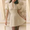 2026 Moda Transfronteriza Europea y Americana para Mujer Vestido de Falda Corta con Cuello Alto de Lunares Sencillo y Elegante que Ceñe la Cintura Adelgazante