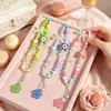 Cadena de cuentas de colores dopamina de moda para teléfono con colgantes de corazón y flor de acrílico para bolsos y cámaras de niñas