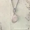Colgante de Venta Caliente Transfronterizo, Moderno y Sencillo, Colgante de Collar con Incrustaciones de Cuarzo Rosa Hueco con Forma de Pera y Lágrima