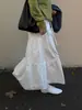 Falda de Pastel Shi Jian para Mujer Cintura Alta Versátil Cubre Caderas Adelgazante Patchwork Falda Blanca 2026 Otoño Nueva de Moda 71539