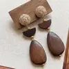 Pendientes de borla con carcasa de madera marrón transfronterizos europeos y americanos, pendientes de estilo vintage Maillard, pendientes de mujer de lujo ligero de alta gama
