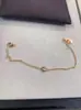 Versión alta tarjeta de collar OVNI familia un diamante femenino V chapado en oro oro de 18 quilates diamante único pequeño colgante redondo collar cadena de clavícula dropshipping
