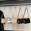 2025 Nueva Moda Simple Bolso Vagabundo Nicho Textura de Alta Gama Bandolera Versátil Bolso de Cadena Hombro Axila Mujer