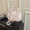 Bolso Pequeño Cuadrado de Mano Moda Simple para Mujer 2026 Verano Nuevo Bolso de Hombro Único con Lazo de Perlas Bolso Cruzado de Moda