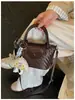 Bolsa pequena vintage de outono e inverno para mulheres 2026 nova moda bolsa transversal versátil bolsa de mão para o trabalho popular bolsa bolinho