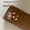 Alta Qualidade Novo Arte de Unha Trevo de Quatro Folhas Joia de Zircônia Liga de Zinco Tridimensional Incrustada com Diamantes Alta Retenção de Cor Acessórios de Unha Vestíveis Atacado