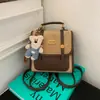 Mochila de Viagem Estilo Britânico Transfronteiriça Retro Versátil Nicho Design de Mochila Bolsa Moda Passeio Portátil Mochila Escolar