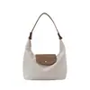 Nova bolsa de ombro único, bolsa de mão de cor sólida nicho, bolsa de tecido de nylon impermeável, moderna e versátil para o dia a dia, bolsa de ombro tipo bolinho