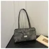 Bolsa feminina 2026 nova tendência única bolsa de ombro design de nicho estilo coreano debaixo do braço casual retrô bolsa de mão para o dia a dia