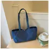 Bolsas de lona casuales de nicho al por mayor para mujer, nuevo bolso tote simple de color liso de gran capacidad, bolso de hombro para el antebrazo para el trabajo