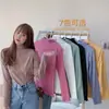 Top base de manga larga de alta gama para mujer, otoño e invierno, elástico, con estilo relajado, caracterizado por un dobladillo con volantes y una textura suave y afelpada.