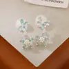 Nuevos Pendientes 2025 Zirconia Incrustada Pendientes de Flor y Mariposa Colgante Largo Fresco Accesible Lujo Bobina de Mosquito Clip para Oreja