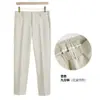 Marca de moda de Hong Kong Pantalones cortos de color liso para otoño para hombre Pantalones de traje ajustados sin arrugas Versión coreana Pantalones casuales de corte slim