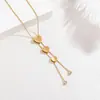 Dongguan Acero de Titanio Joyería Cadena de Suéter Transfronterizo Corazón Escarchado Borla Collar Oro 18K Moda de Gama Alta Versátil Mujer