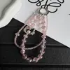 Cadena para teléfono de gato de dibujos animados hueca con diamantes de imitación de lujo de alta gama, llavero corto de cristal, colgante para bolso, modelo nuevo