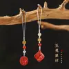 Conejo de Jade resorte retro cinabrio año de nacimiento moda nacional artístico retro cadena para teléfono móvil Conejo de Jade colgante para hombre y mujer