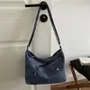 Otoño 2026 Nuevo Bolso de Mezclilla Bolso Cruzado Casual Estilo Perezoso Bolso de Tela Artístico para el Trabajo Bolso Cruzado Pequeño