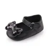 Zapatos para bebé primavera y otoño nuevos para niña con lazo lindos zapatos de princesa boca poco profunda suela de goma zapatos para niño pequeño venta al por mayor 2362