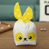50 13.5*22 orejas de conejo bolsa de caramelo de galleta bolsa de embalaje de plástico con orejas de conejo tridimensionales en stock al por mayor