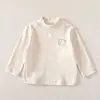 Camiseta Básica de Manga Longa para Bebê 2026 Novo Estilo Macia e Confortável para Bebê Roupas Listradas Elegantes Versátil Top de Cor Sólida