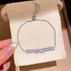 Pulsera con cierre de corazón de colores y circonitas brillantes, sensación de lujo ligero de alta gama, joyería versátil para mujer con personalidad dulce y nicho