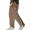Calça masculina transfronteiriça com botões laterais, calça esportiva casual de perna larga lisa para primavera/outono da Amazon, calça de moletom versátil de perna reta