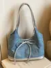 Bolsa jeans feminina 2026 nova tendência moda bolsa de ombro única bolsa tote de grande capacidade para escola e trabalho