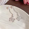 Colgante de flor de aguja plateada pendientes de botón con perla pendientes simples de alta gama de moda nicho pendientes versátiles delicados y exquisitos para mujer