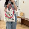 Cadena de bolitas gama alta redonda mismo estilo parte superior bordado de flores y plantas japonesas bolsa de protección ambiental bolsa de compras bordado nailon