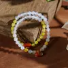 Nuevos brazaletes de estilo étnico, brazaletes de cristal hechos a mano de nicho para estudiantes, niñas, parejas y mejores amigos, al por mayor