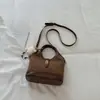 Bolso cubeta liso estilo coreano, bolso de mano y bolso cruzado de alta apariencia, nuevo modelo otoño 2026, bolso de mano personalizado y moderno para el día a día