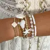 Conjunto de pulseiras de férias estilo boêmio transfronteiriço europeu e americano, pulseira multicamadas com sementes, concha e estrela-do-mar