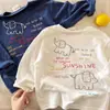 Camiseta de manga larga de dibujos animados para niños, nuevo estilo primavera/otoño 2026, unisex, con estampado de letras, camiseta interior de algodón para bebé, moderna