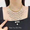 Colar de pérolas com borlas estreladas multicamadas versátil da moda europeia e americana, acessório de corrente para clavícula nupcial requintado de luxo leve francês