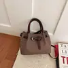 Bolso tote pequeño de alta gama, nicho, súper popular, esencial para el trabajo, para mujer, nuevo otoño 2026, bandolera, bolso cubo cruzado